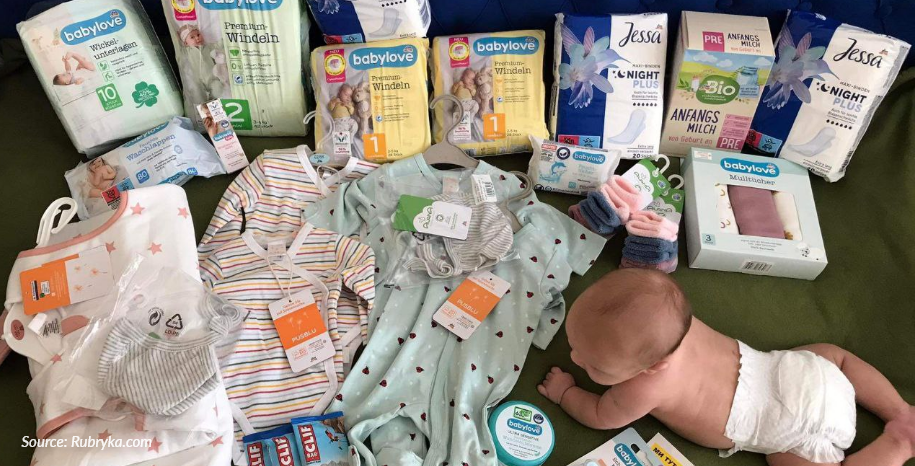 Picture showing a baby and infant supplies including diapers, powdered milk and more